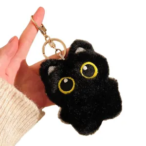 Cute black plush cat keychain with big yellow eyes and golden metal lobster clasp charm