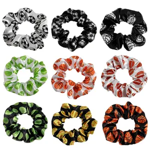 Set of 9 sports themed satin scrunchies featuring football, basketball, and tennis patterns