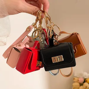 Mini portachiavi a borsa in pelle in cinque colori con moschettoni dorati di alta qualità