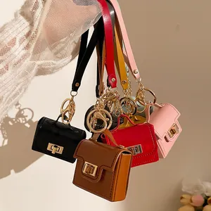 Portachiavi a mini borsa in ecopelle colori nero, rosso, marrone, rosa e giallo con metallo oro