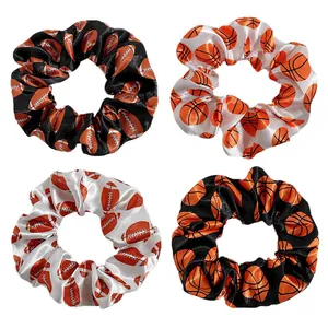 Set of 4 satin hair scrunchies with basketball and football sports prints on black and white