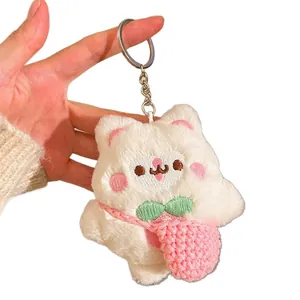 Porte-clés chat en peluche avec nœud vert et petit sac rose pour sac à main