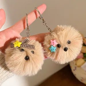Pluchen puppy sleutelhanger met pluizig bruin imitatiebont en ster knopen