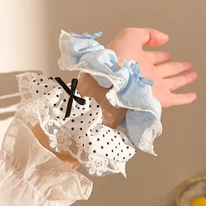 Coleteros de lunares con encaje y lazo para moños en colores azul claro y blanco