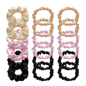 Set of 18 elastic satin scrunchies in three sizes and neutral colors on white background