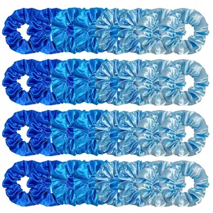 Set of 32 satin hair scrunchies in four shades of blue neatly arranged on white background