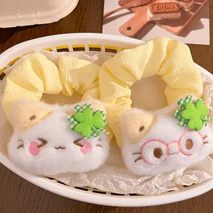 Cute plush cat hair scrunchies with lucky clover design in soft yellow fabric