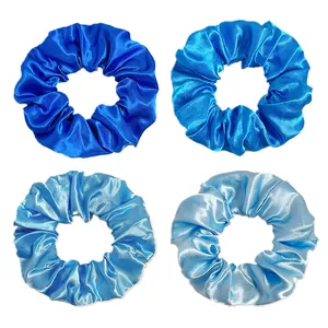 Set of four blue gradient satin scrunchies in varied shades with a silky finish