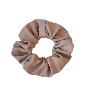 Elegant brown striped oversized scrunchie for women with textured fabric and soft folds