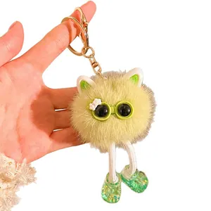 Porte-clés monstre en peluche jaune avec lunettes vertes et longues jambes en corde