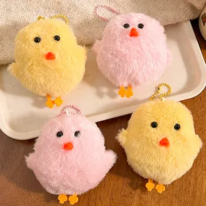 Cute plush chick keychains in pink and yellow with soft fur and beaded chains