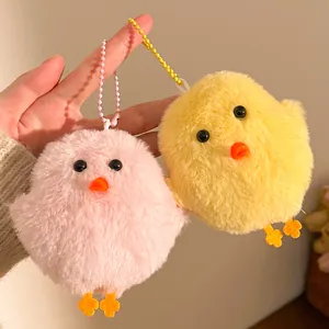 Close-up of soft plush chick pendants in pink and yellow with colorful bead chains