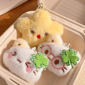 Plush clover cat and star charms set with soft fur texture and gold keychains