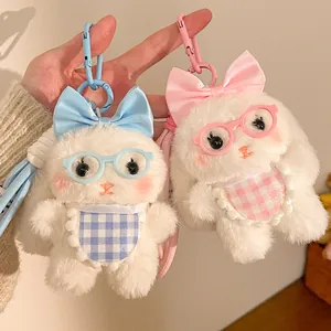 Cute plush lop-eared rabbit keychains in blue and pink with glasses and bows