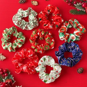 Christmas theme scrunchies set featuring festive patterns on glossy satin fabric