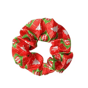 Festive Christmas scrunchie set in red and green satin with holiday tree patterns