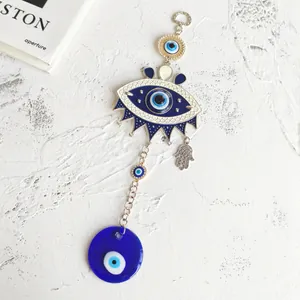 Turkish evil eye wall hanging with Hamsa hand and blue glass beads for home decor