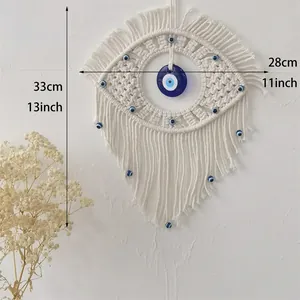 Handmade bohemian evil eye wall hanging decor with white cotton rope and blue beads