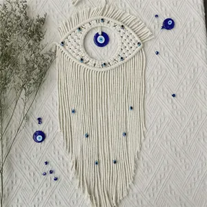 Handmade macrame evil eye wall hanging decor with blue beads and bohemian fringe