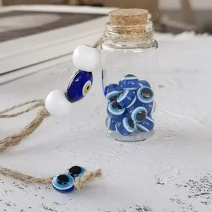Detailed view of Turkish evil eye glass beads inside a corked bottle with hemp rope