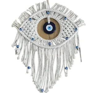 Handmade Bohemian Evil Eye wall hanging with off-white cotton rope and blue glass beads