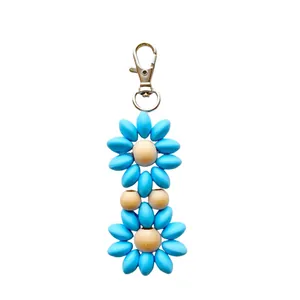 Sky blue silicone bead and natural wood flower keychain with silver metal lobster clasp
