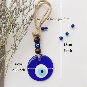 Handmade Evil Eye wall hanging with blue glass pendant and braided rope decor