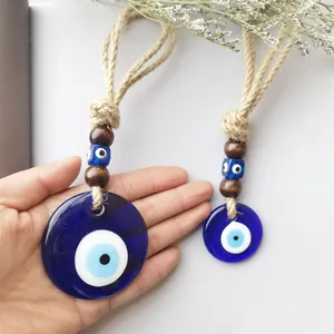 Handmade Evil Eye wall hanging set with blue resin charms and rustic hemp rope accents