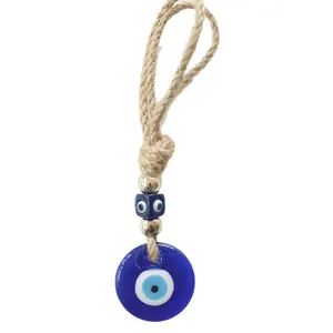 Turkish evil eye wall hanging ornament with blue glass pendant and jute rope cord