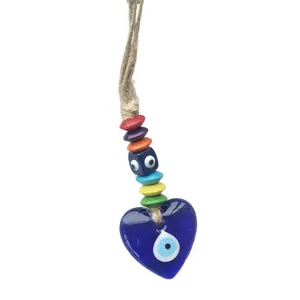 Handmade evil eye heart wall hanging with colorful wooden beads and a natural rope strap