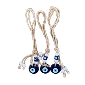 Set of three handmade woven evil eye wall hangings with jute ropes and glass beads