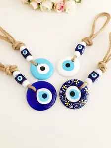 Set di quattro ciondoli portafortuna Malocchio Nazar con corda di iuta e perle in vetro blu