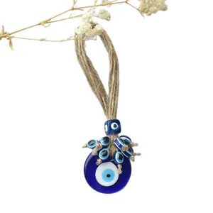 Decorazione da parete Evil Eye fatta a mano con perline blu e corda di juta rustica