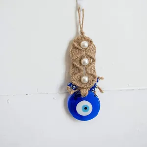 Blue glass evil eye wall hanging with woven hemp rope and faux pearls home decor