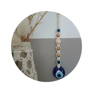 Bohemian Evil Eye wall hanging with woven macrame and blue glass pendant home decor