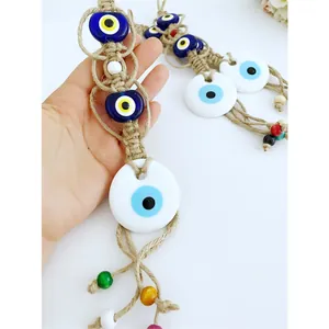 Decorazione da parete Malocchio fatta a mano con occhi in vetro blu e corda di canapa
