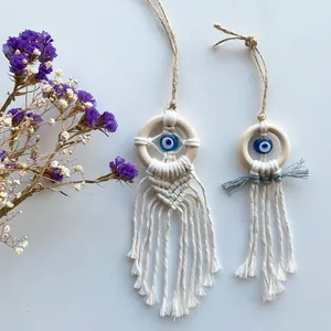 Handmade boho macrame evil eye wall hanging set with wooden rings and cotton tassels