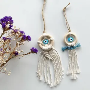 Handwoven boho evil eye charms with wooden rings and white cotton tassels set