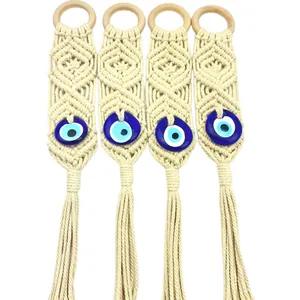 Bohemian handmade cotton wall hanging with Evil Eye bead and tassel decorations