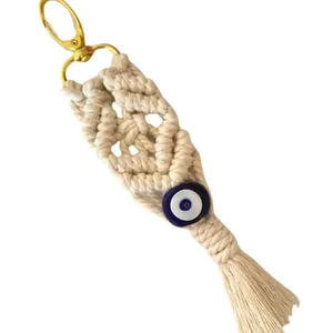 Handmade woven cotton evil eye keychain with tassel and golden metal lobster clasp