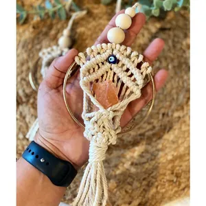 Detailed Macrame wall hanging with pink raw stone and blue evil eye bead accent