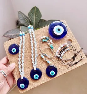 Handmade Evil Eye jewelry set featuring blue glass pendants and woven cotton cord charms