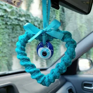Handmade knitted heart Evil Eye car charm with blue bow for rearview mirror decor