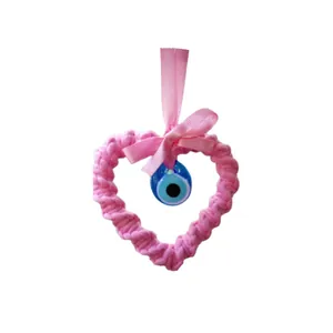 Handmade pink woven heart pendant with blue Evil Eye bead and ribbon bow for car decor