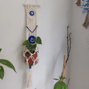 Bohemian handmade macrame wall hanging with evil eye beads and long tassels