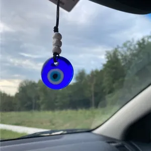 Handmade Evil Eye car mirror charm with blue glass nazar pendant and white wooden beads