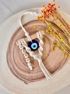 Handmade macrame Evil Eye wall hanging with cotton tassel and LOVE wooden beads