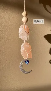 Handmade Bohemian crystal wall hanging with pink salt stone and evil eye moon charm