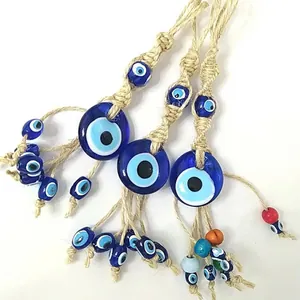 Mediterranean Turkish Evil Eye wall hanging with blue glass beads and woven hemp rope