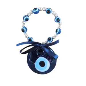 Ciondolo turco Malocchio in vetro con nastro di raso blu e perline argentate decorative